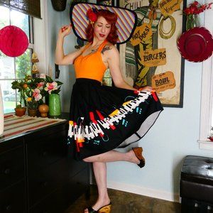 Collectif Black Circle Skirt with Piano & Teal Accent